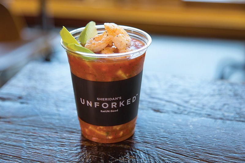 Looking to do more with seafood, Sheridan’s Unforked has added innovative shrimp dishes to the menu, such as this playful Gazpach-oh! topped with hot seared shrimp.