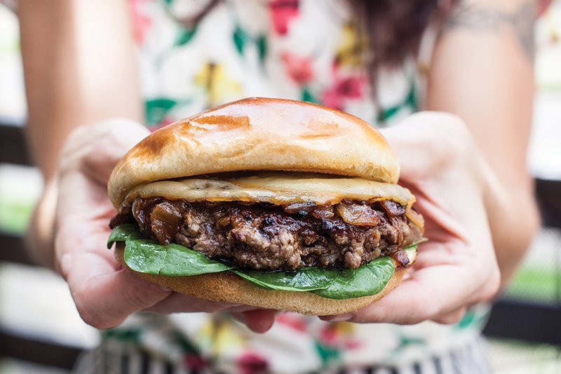The Smokey Gouda Burger at Avenue Eats in Wheeling, W. Va., carries a sweetness and hint of hickory smoke from the melted layer of smoked Gouda.