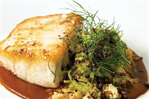 Flavor-loaded sauces are the key to dishes like the Pescado en Mole Amarillo at Topolobampo. Caramelized wild Alaskan halibut with Oaxacan yellow mole comes with sweet corn tamal “couscous” and baby fennel salad.